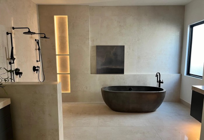 Standalone tub and walk-in shower highlight the primary bathroom in a custom home by Erwin Jaye Luxury Homes in Arizona.