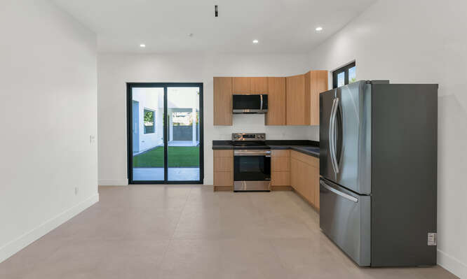 A custom guesthouse addition boasts a full-size kitchen.